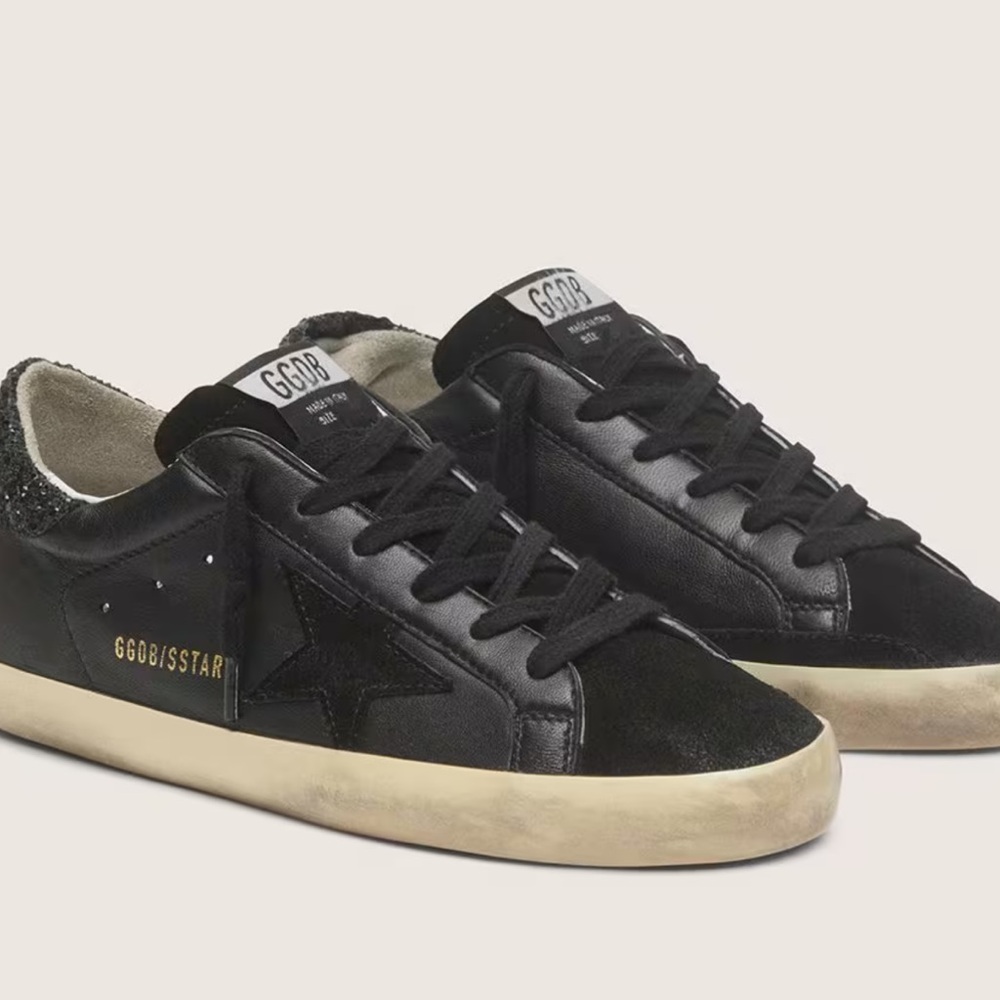 Women's Super-Star in black nappa with black star and glitter heel tab.